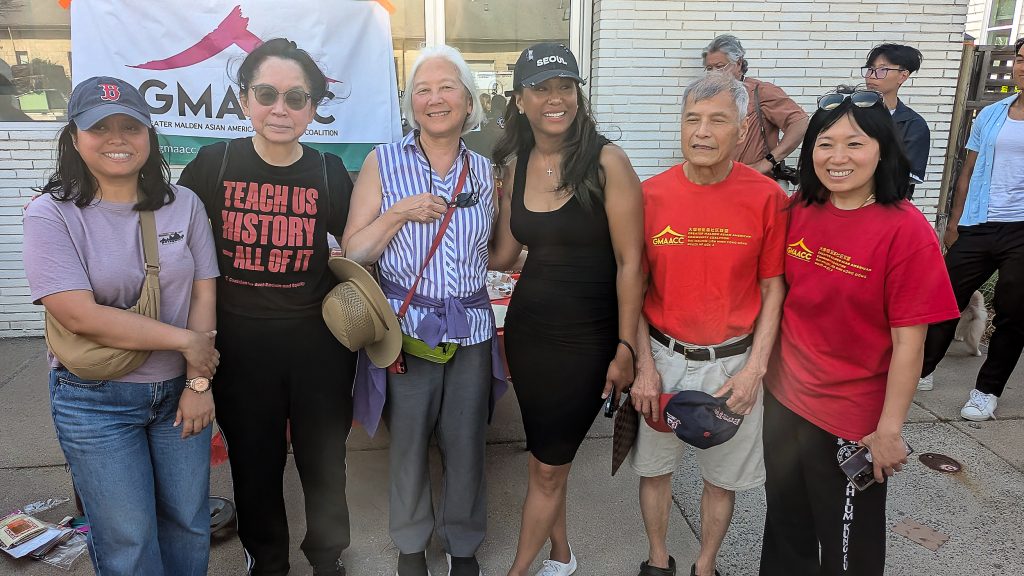 Six people posing for camera.