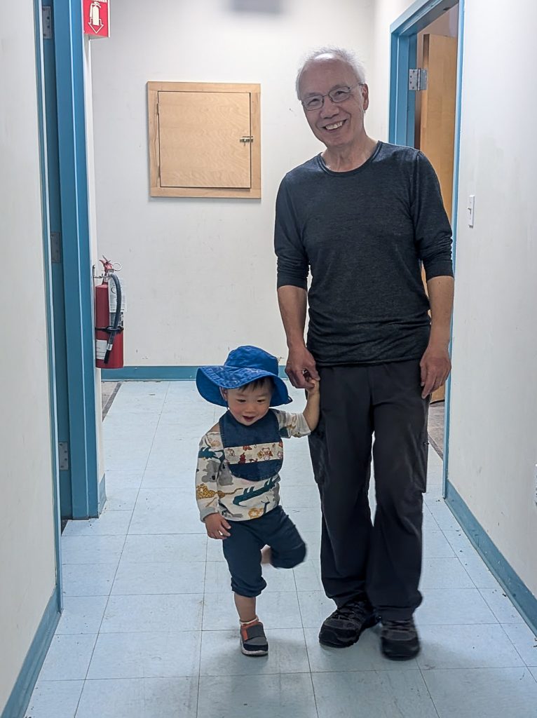 A grandfather and his grandson tour the new Malden Asian American community center, which will host multigenerational events.
