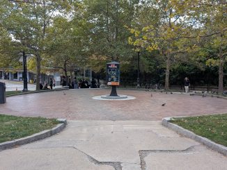 The circle park at Malden Station without benches