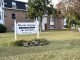 Bryant Terrace Apartments sign with phone number and 62 Willow St. address, in front of apt buildings.